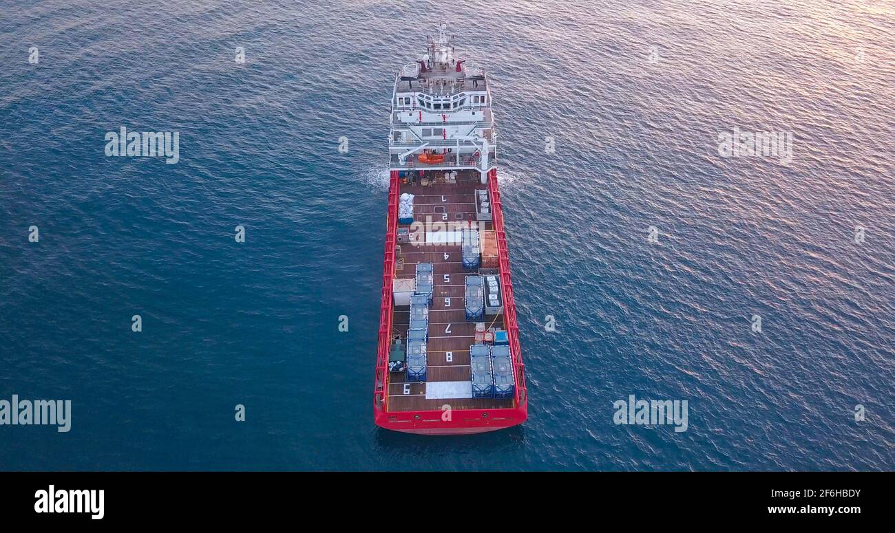 Offshore Supply Ship in the calm ocean water. Stock Photo