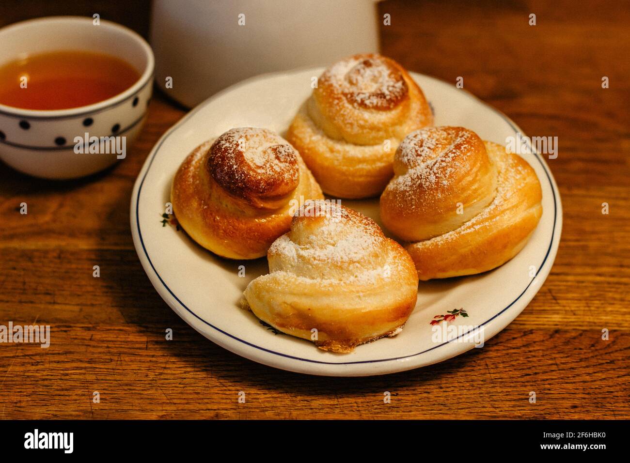 Traditional Easter baking served with honey at breakfast. Delicious homemade hot buns from sweet yeast dough,CZ jidase, traditionally baked in Czech Stock Photo