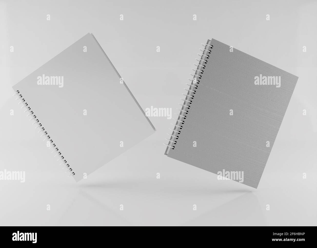 Two flying paper notebooks 3d rendering for mockup Stock Photo