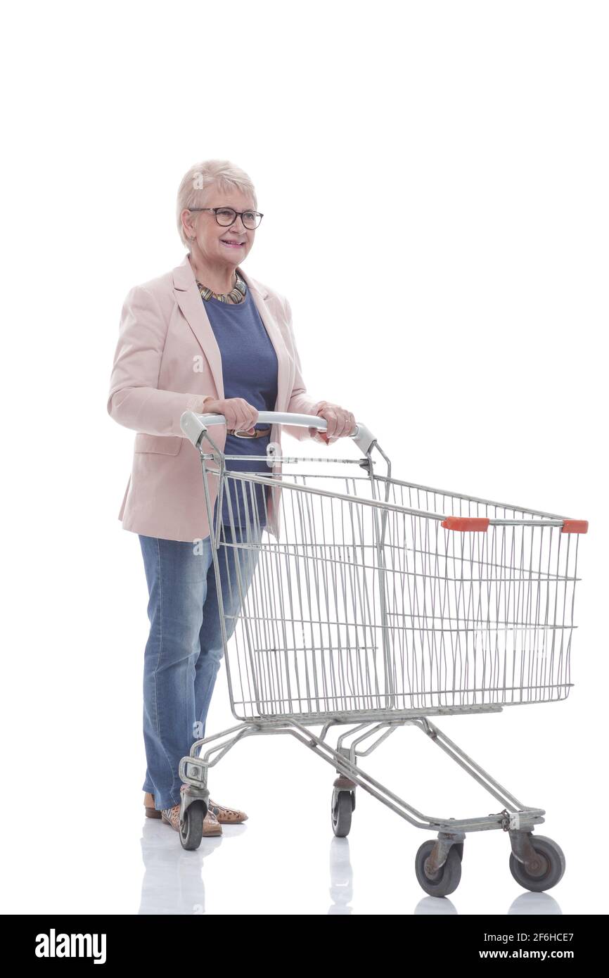 in full growth. happy elderly woman pushing a shopping cart Stock Photo