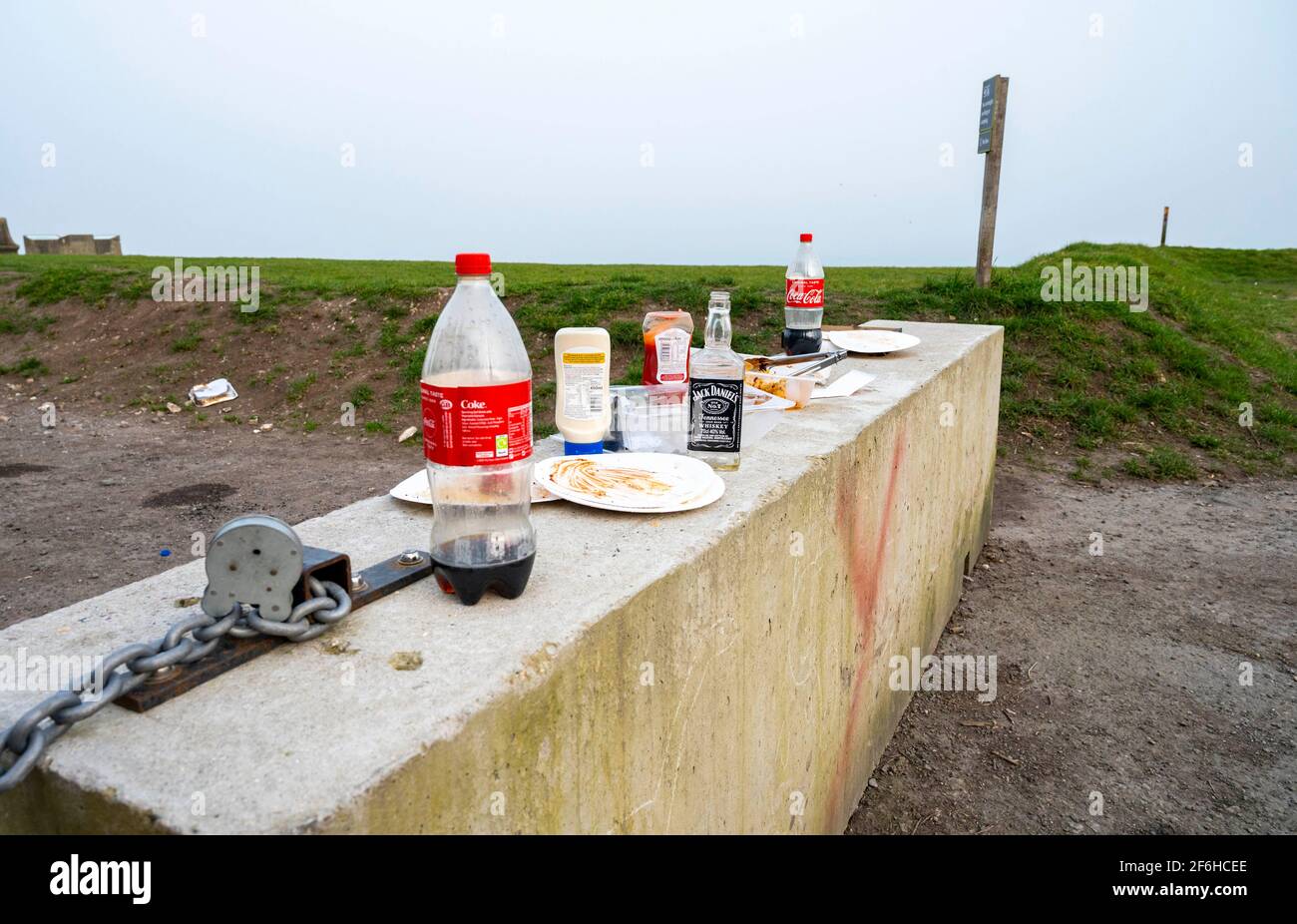 Brighton UK 30th March 2021 - The remnants of an overnight bbq and a party left on Devils Dyke beauty spot near Brighton as the sun tries to burn off the early morning mist :  Credit Simon Dack / Alamy Live News Stock Photo