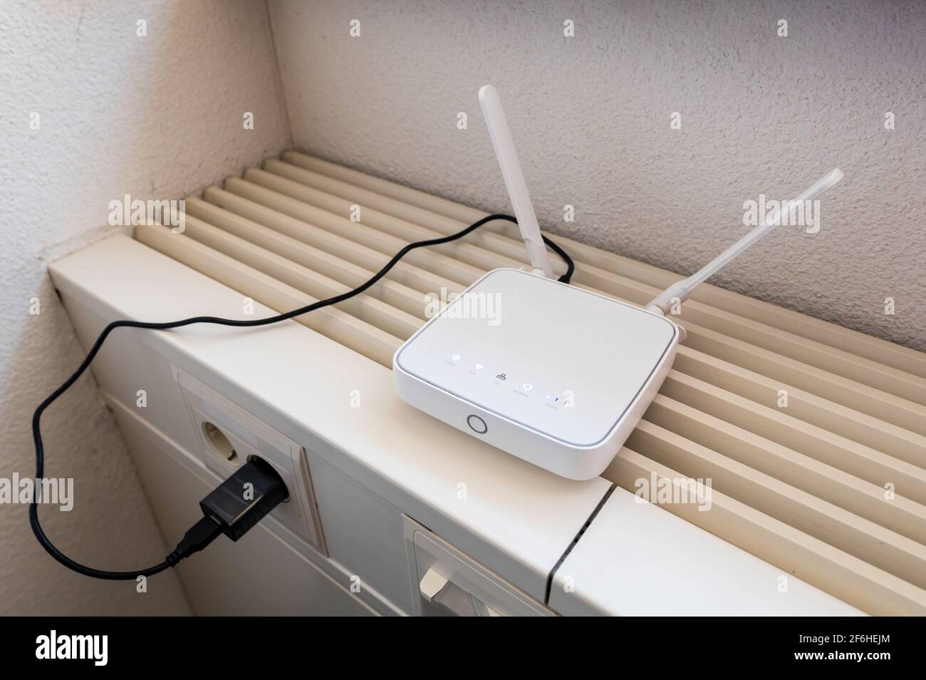 A wifi router on a heater Stock Photo - Alamy