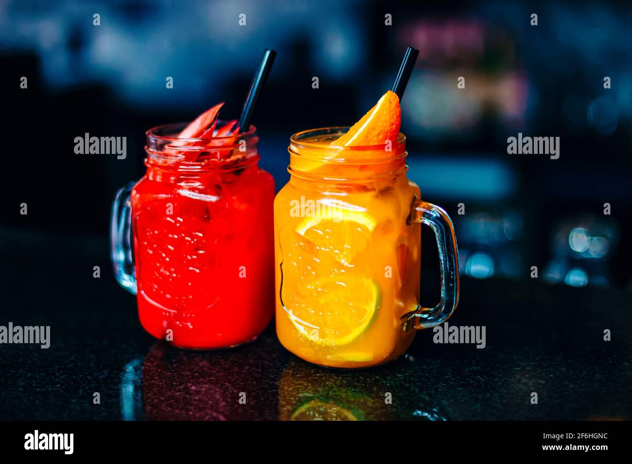 Colorful vodka and rum cocktails served in Mason Jars or a glass