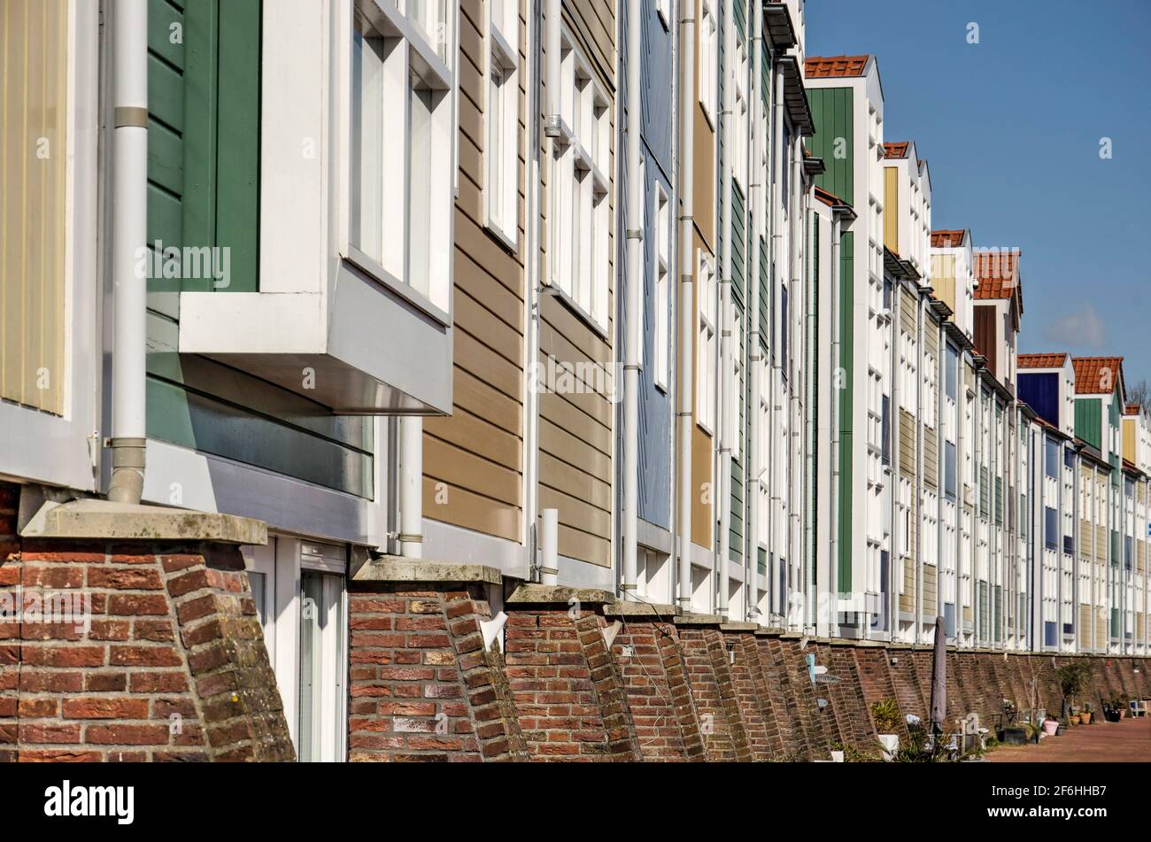 Hellevoetsluis, The Netherlands, March 19, 2021: colorful new wooden quay houses inside the old fortified town Stock Photo