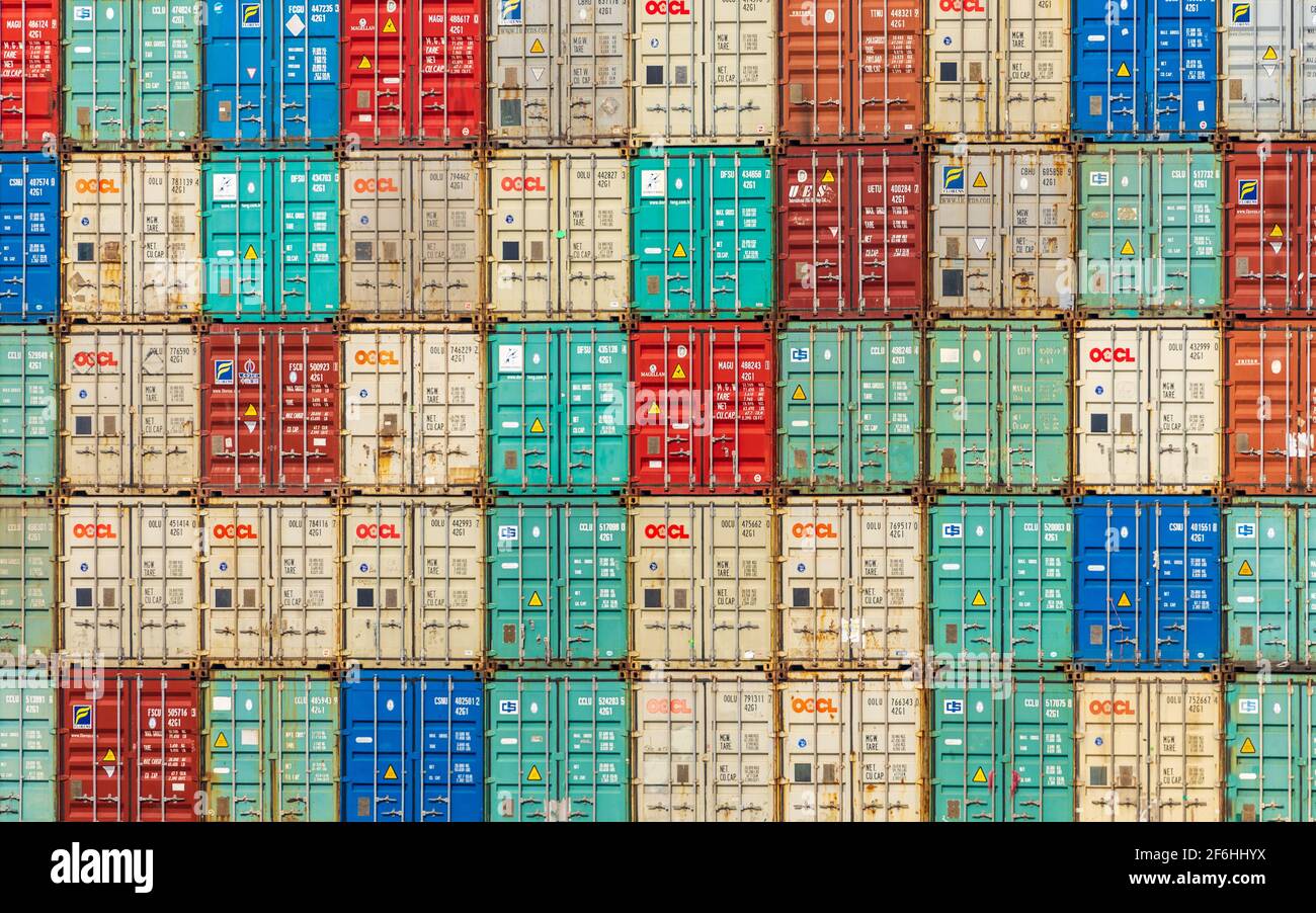 Shipping Containers - a wall of multi coloured Intermodal Shipping Containers form a colourful mosaic. Stock Photo