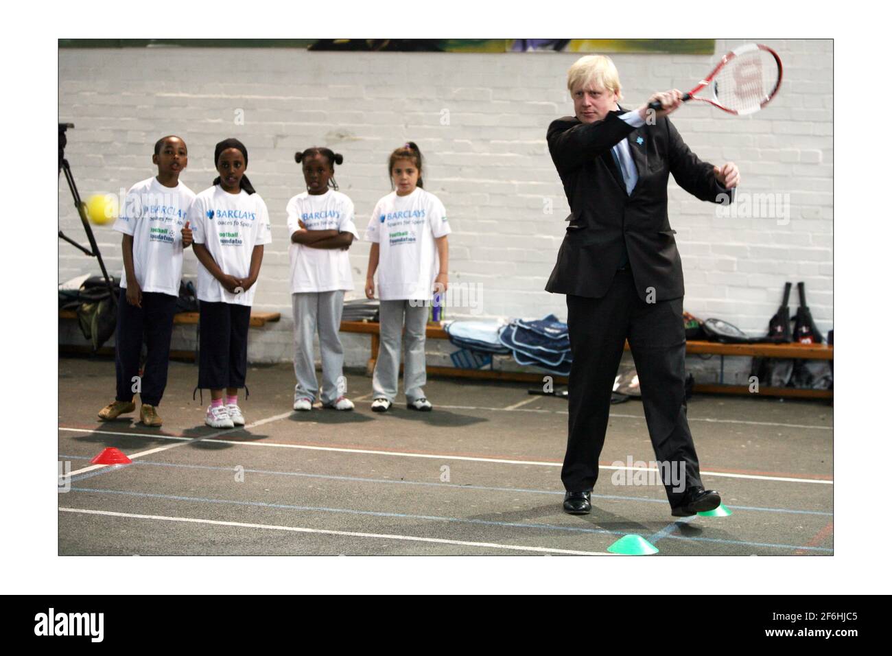 London Mayor Boris Johnson arrives with MP for Vauxhall Kate Hoey during a  visit to open new local community tennis courts at the old site of the old  Lillian Baylis school in