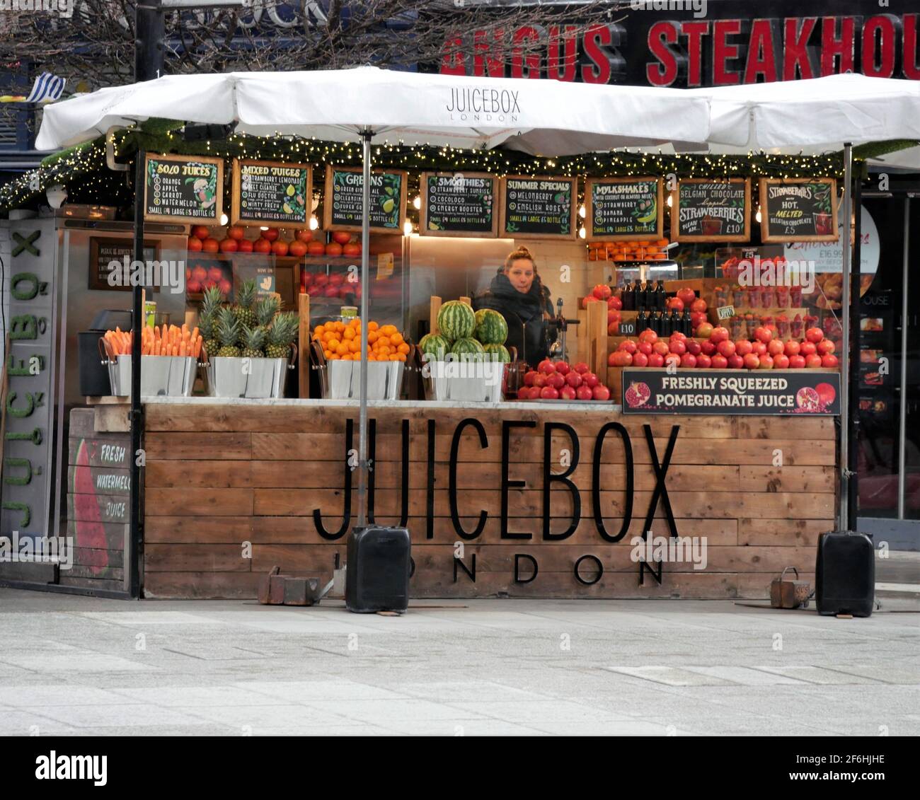 Juicebox stall in Oxford Street, London selling fruit and vegetables to