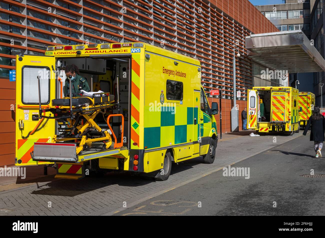 Emergency Ambulances waiting by the side of The Royal London Hospital in the East End of London. Stock Photo