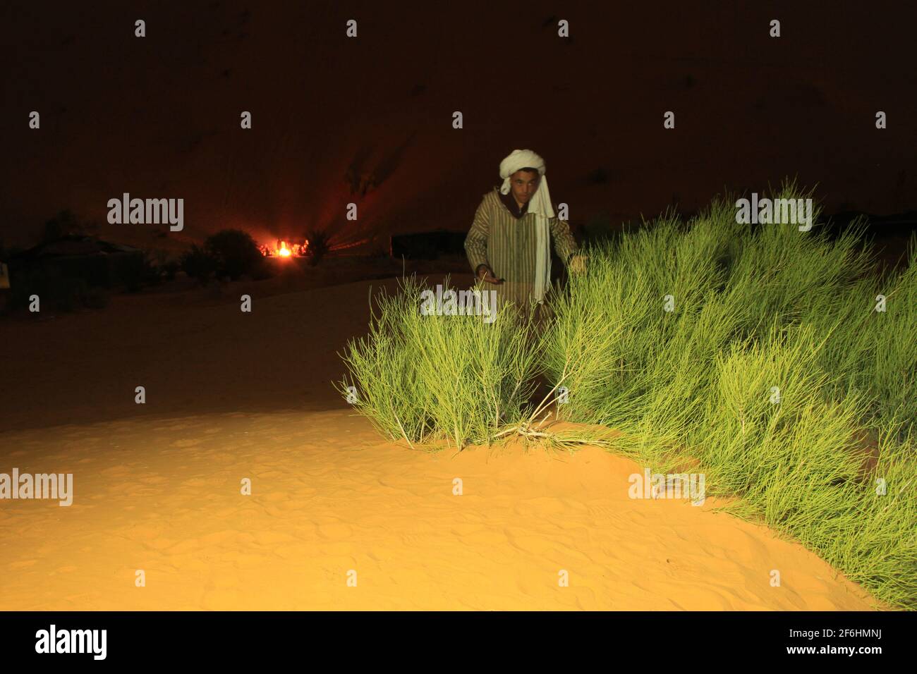 Bedouine at mystic campfire in desert at night (Sahara, Merzouga) Stock Photo
