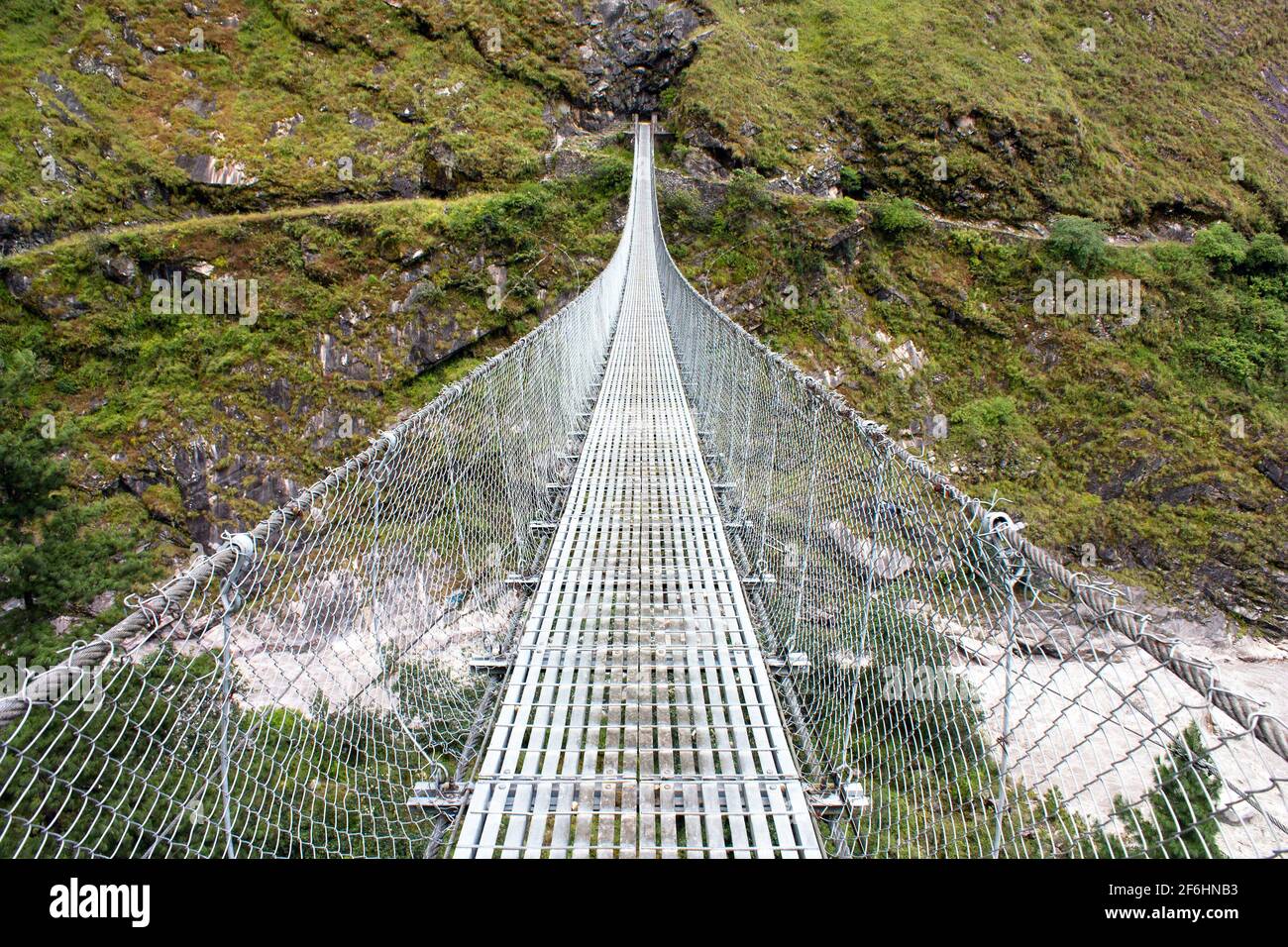 rope hanging suspension bridge Everest base camp trek in Nepal Stock