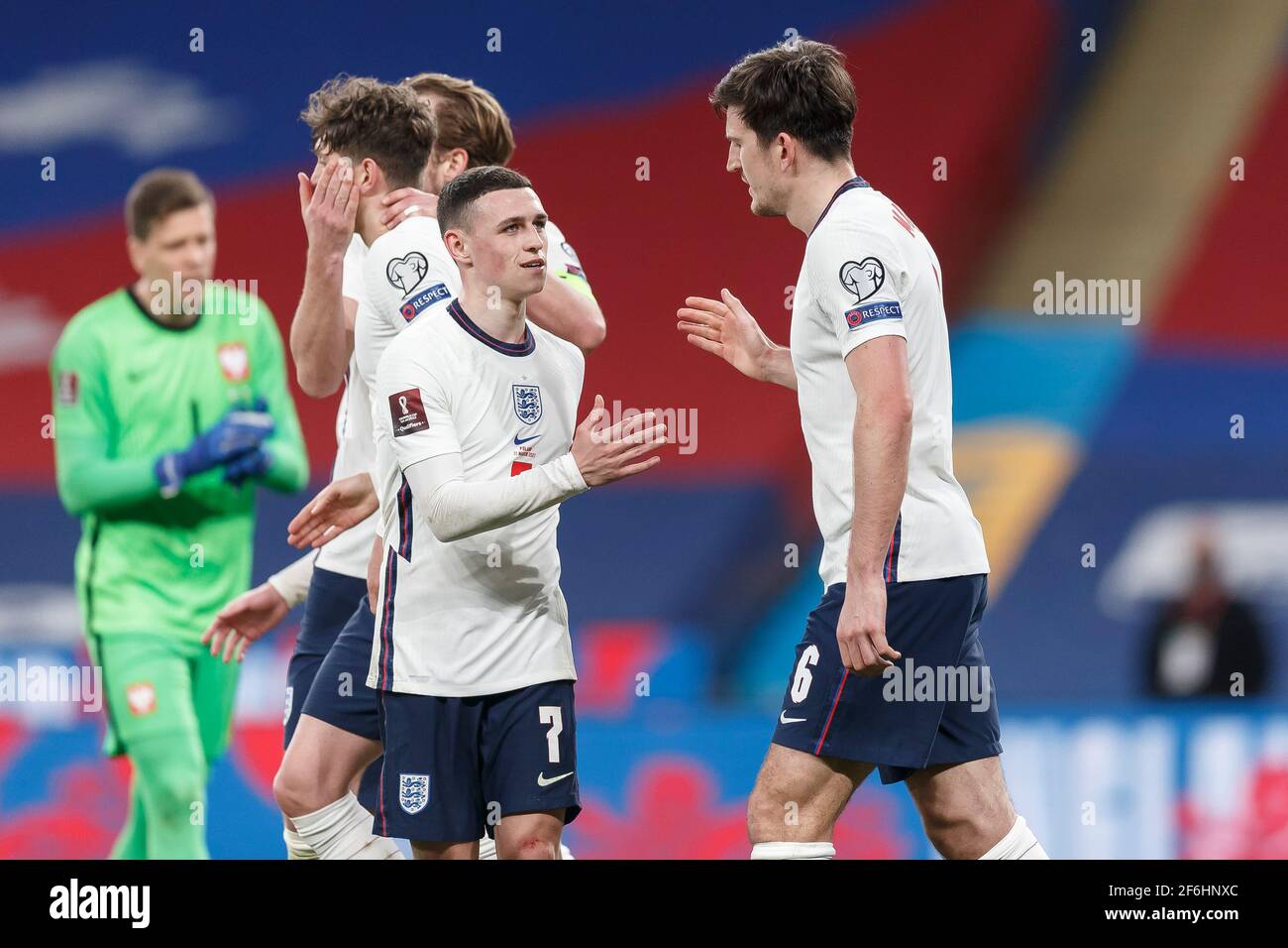 London, UK. 31st Mar, 2021. Harry Maguire of England celebrates with Phil Foden of England after scoring their second goal to make the score 2-1 during the FIFA World Cup 2022 Qualifying Group I match between England and Poland at Wembley Stadium on March 31st 2021 in London, England. (Photo by Daniel Chesterton/phcimages.com) Credit: PHC Images/Alamy Live News Stock Photo