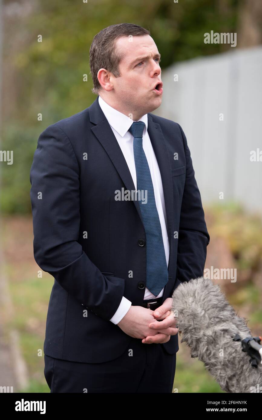 Glasgow, Scotland, UK. 1st Apr, 2021. PICTURED: Douglas Ross MP. Douglas Ross will meets candidate and GP Sandesh Gulhane to unveil a banner on the vaccine rollout and announce the party's NHS spending pledges. Pic Credit: Colin Fisher/Alamy Live News Stock Photo