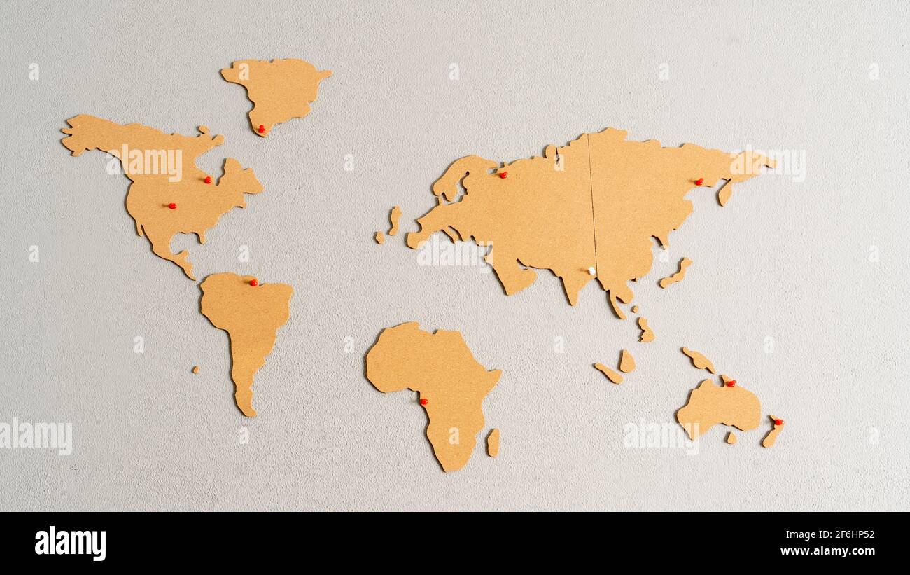 horizontal image of world map made of cork pasted on the wall of the living room Stock Photo