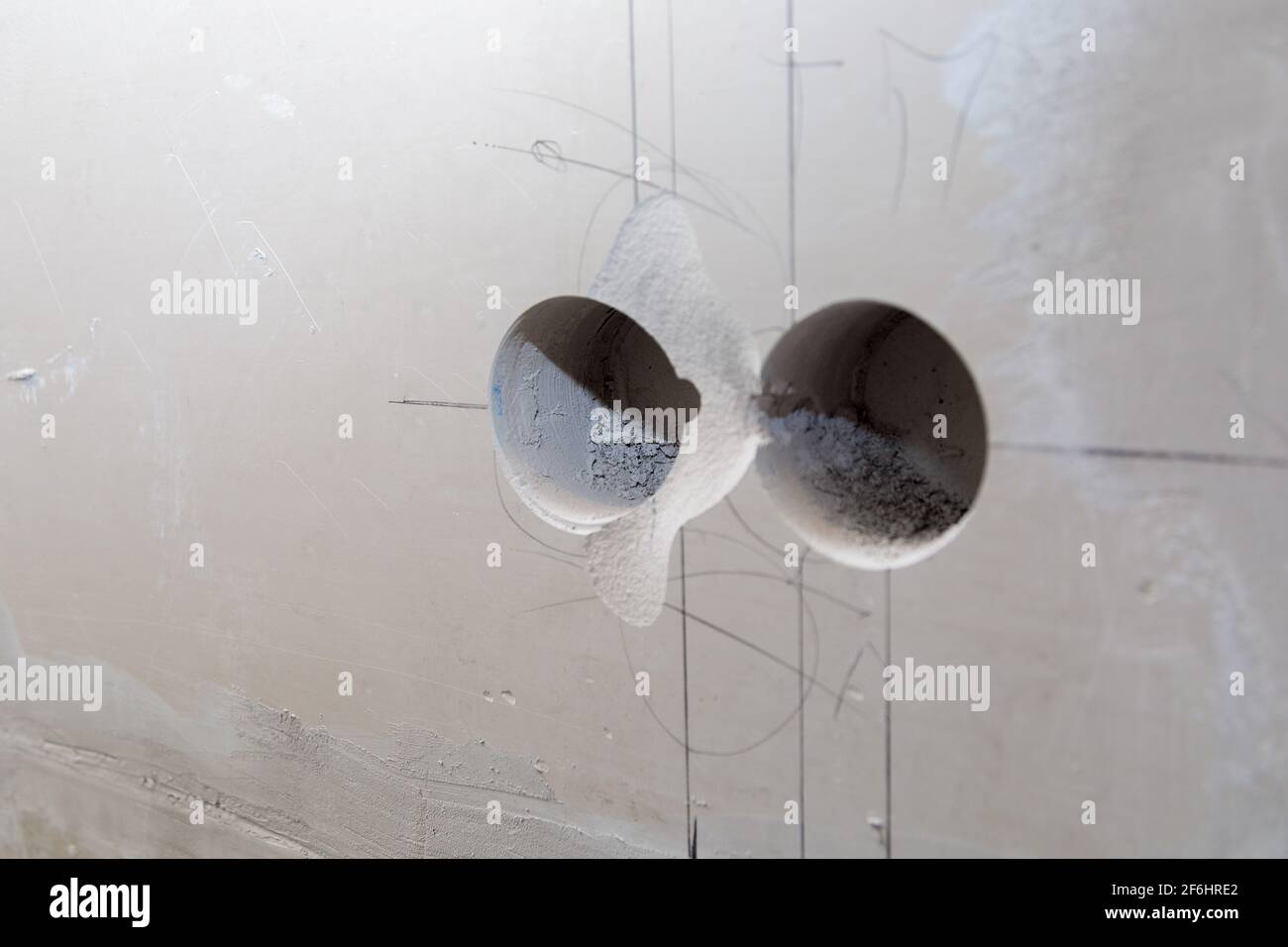 Holes in the wall for sockets. Electrical wiring in the wall. Repair, marking of sockets Stock