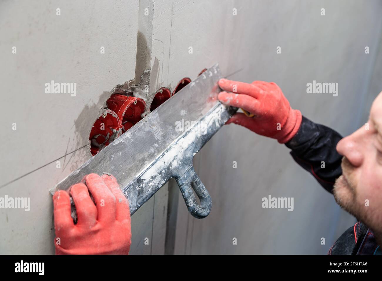 The electrician will plaster holes and channels for sockets and wires