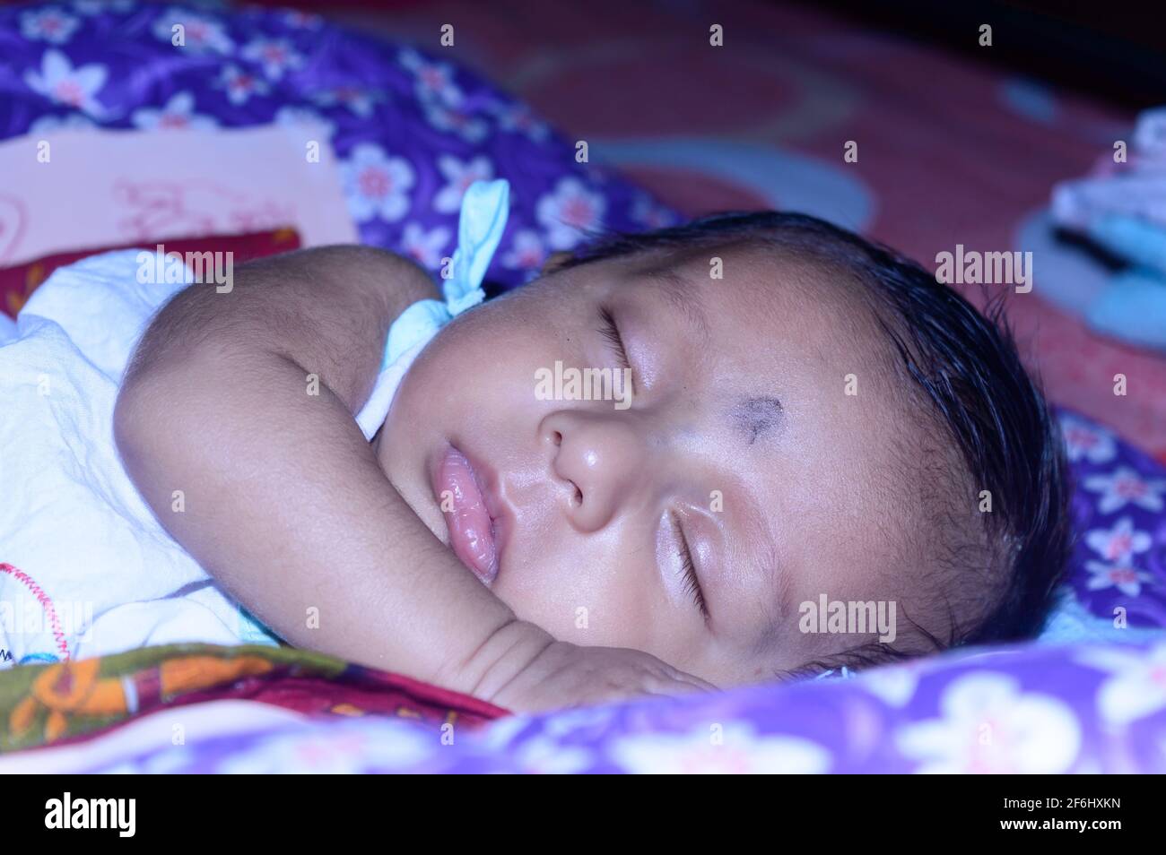 Close up face of a cute sleeping newborn baby. Closeup portrait of