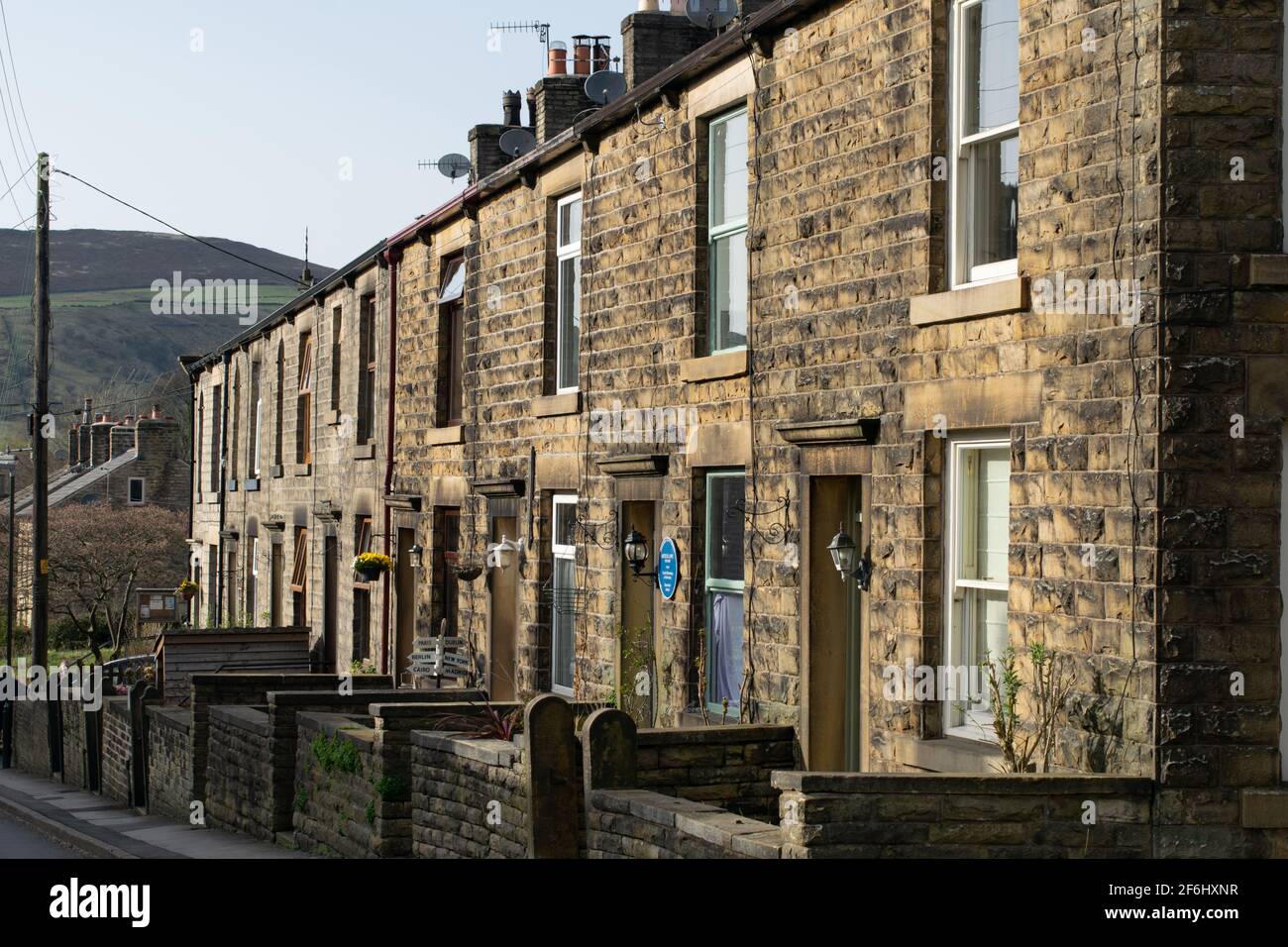 Row of terraced houses on Kinder Road, Hayfield, Derbyshire including house where British actor Arthur Lowe was born Stock Photo
