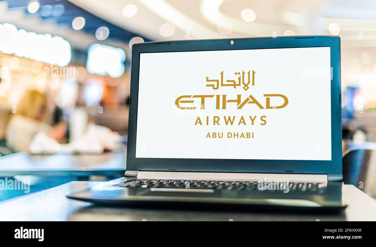 POZNAN, POL MAR 15, 2021 Laptop computer displaying logo of Etihad Airways headquartered in