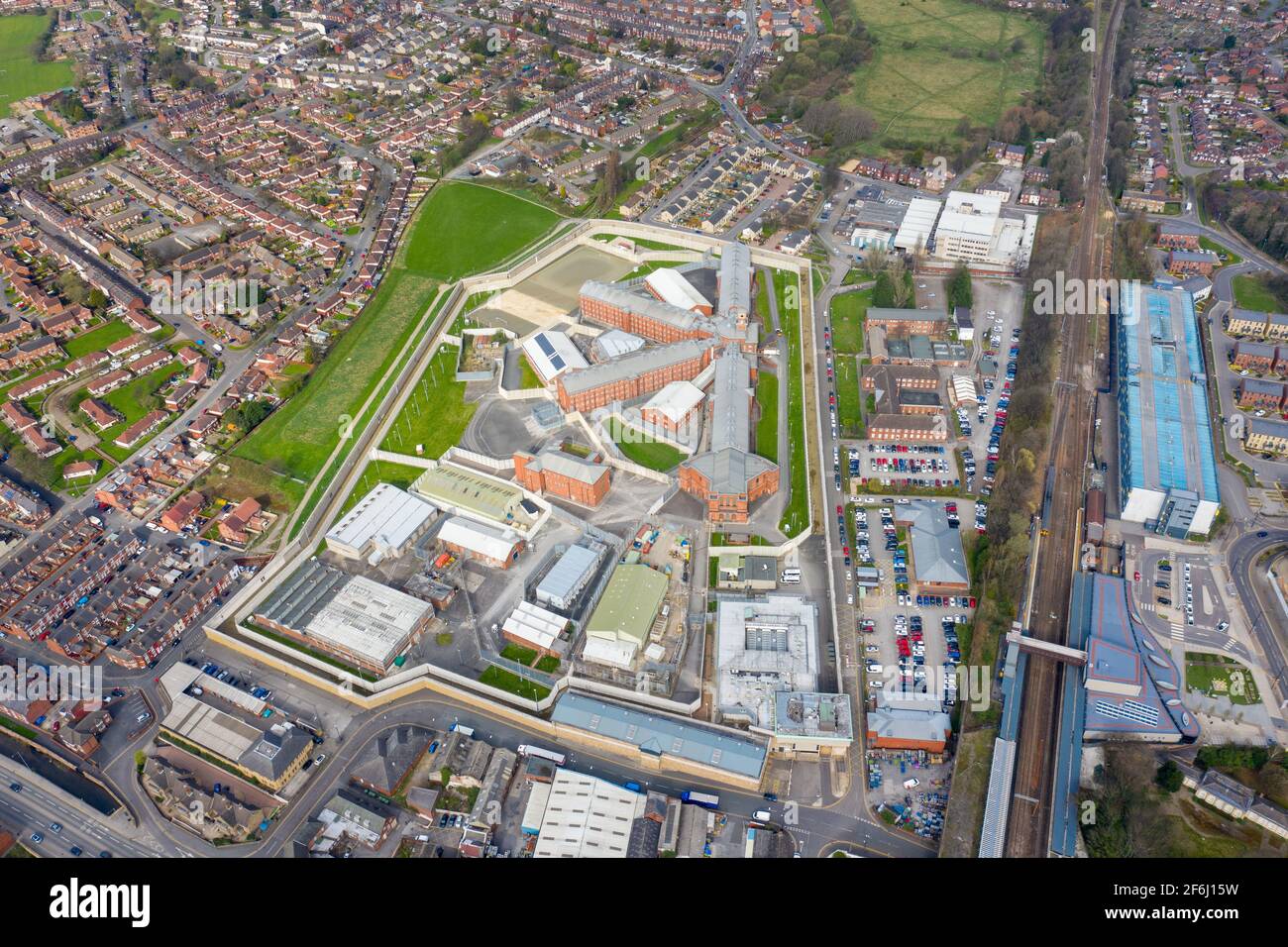 Aerial drone photo of the town centre of Wakefield in West Yorkshire in the UK showing the main building and walls of Her Majesty's Prison, also know Stock Photo