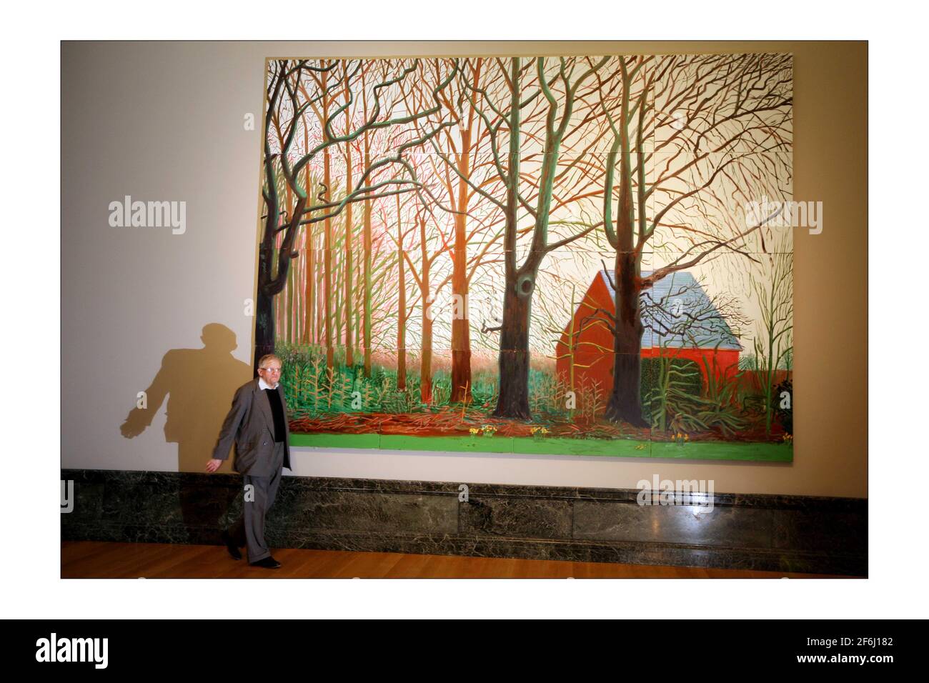 British artist David Hockney (L) poses for photographs next to a segment of his painting 'Bigger Tree's near Warter', at the Tate Britain in London. David Hockney has donated the artwork to the Tate Britainphotograph by David Sandison The Independent 7/4/2008 Stock Photo