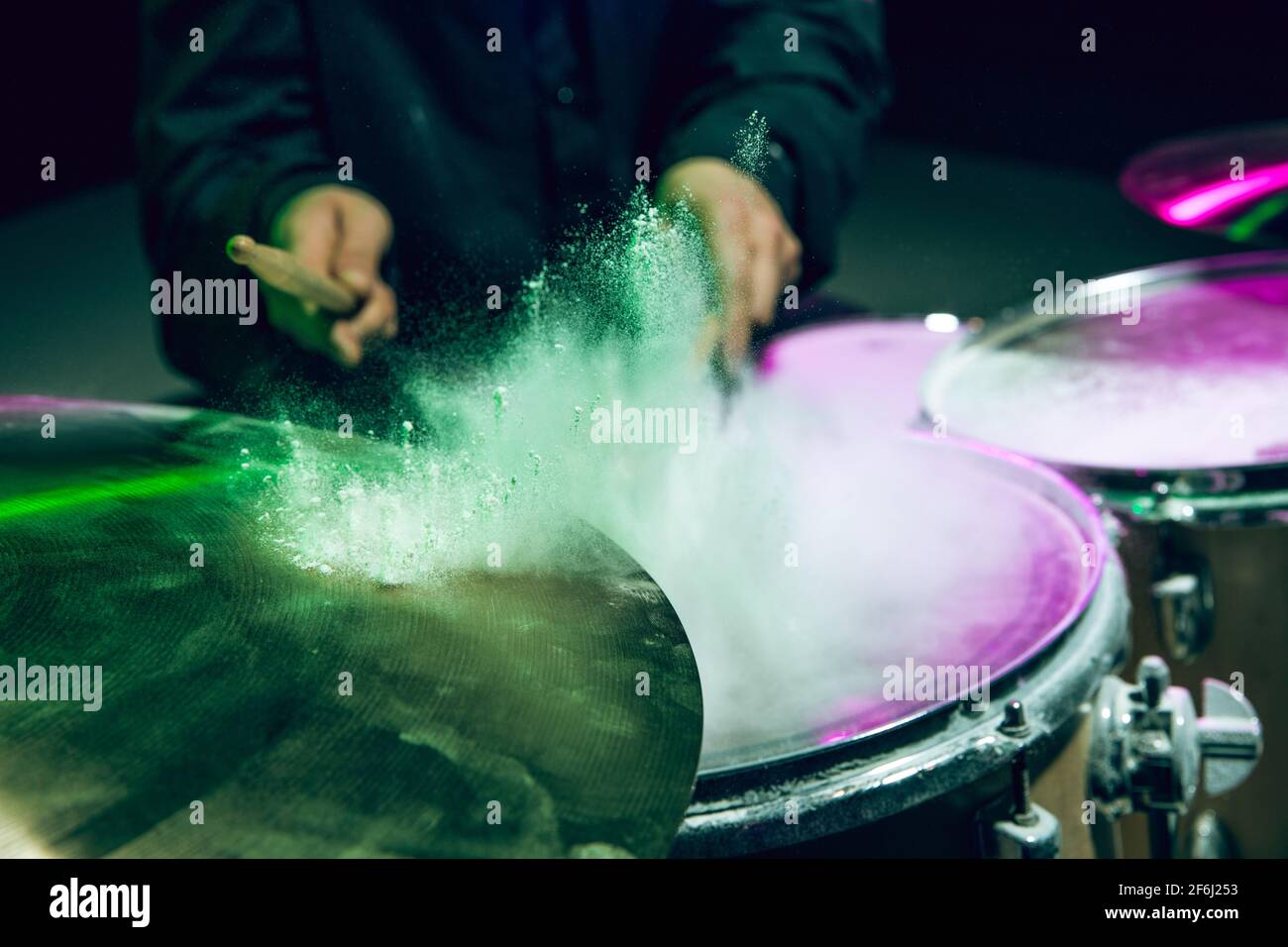 Drummer's rehearsing on drums before rock concert. Man recording music