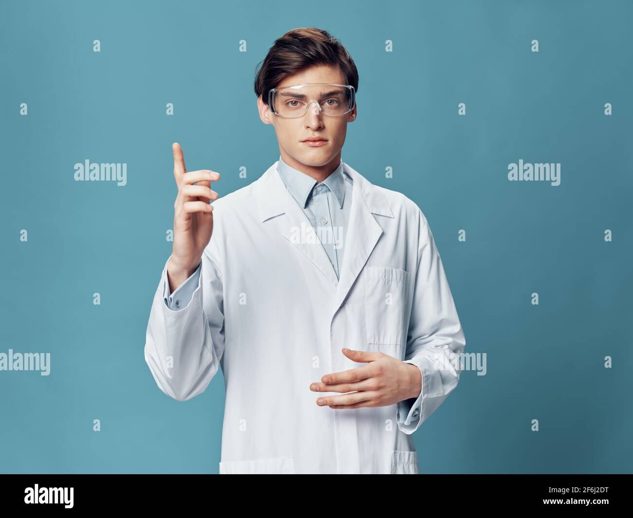 male doctor doing robe laboratory tests coronavirus hospital Stock