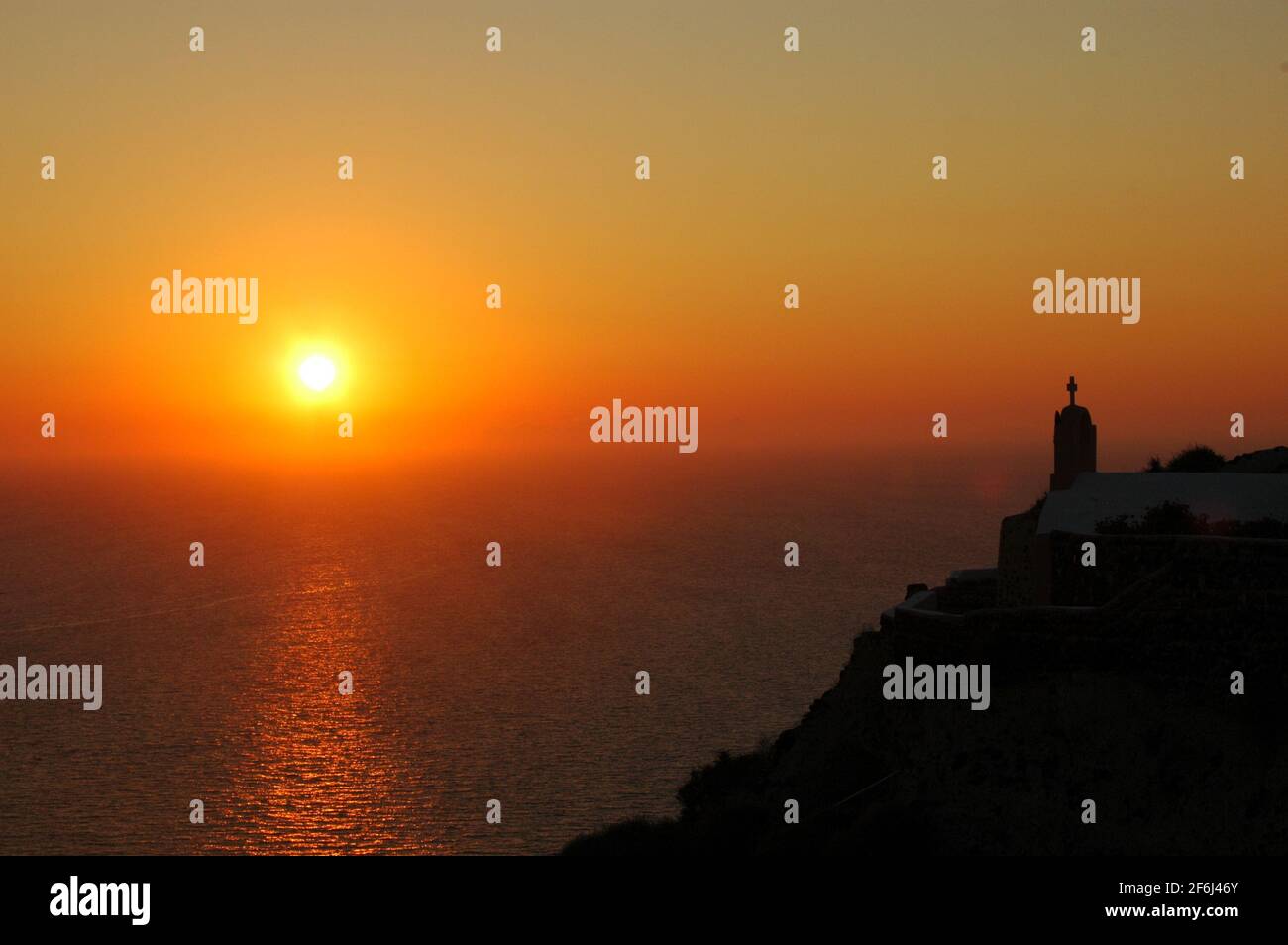 Sunset Over Oia On The Island Of Santorini In The Aegean Sea. Stock Photo