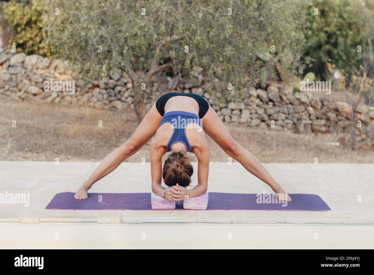 Young woman practicing stretching hi-res stock photography and images ...