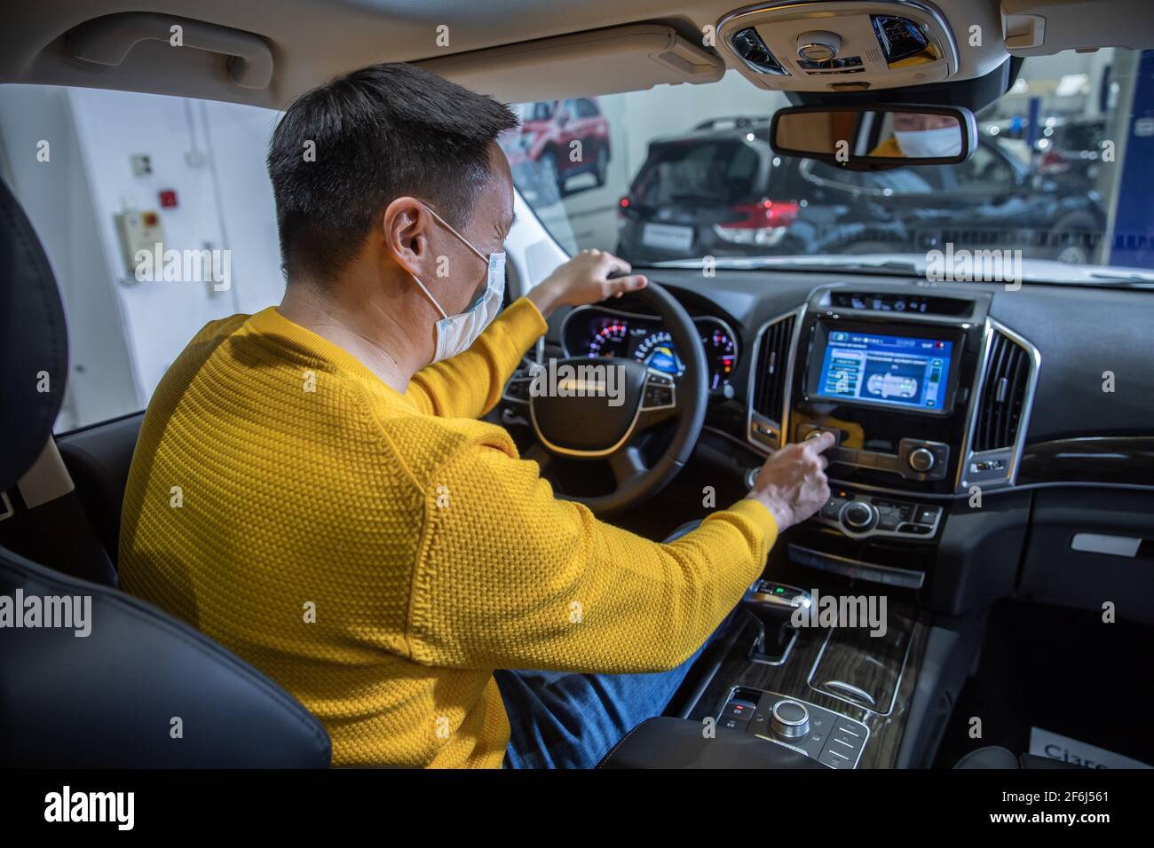 (210401) -- ALMATY, April 1, 2021 (Xinhua) -- A man tries a HAVAL car at a dealer shop in Almaty, Kazakhstan, April 1, 2021. Great Wall Motor Co., Ltd.'s HAVAL brand entered the Kazakhstan market on thursday, three main models of crossover vehicles F7, F7x and off-road vehicle H9 officially began the sales to Kazakhstan residents in Almaty. (Astana Motors/Handout via Xinhua) Stock Photo