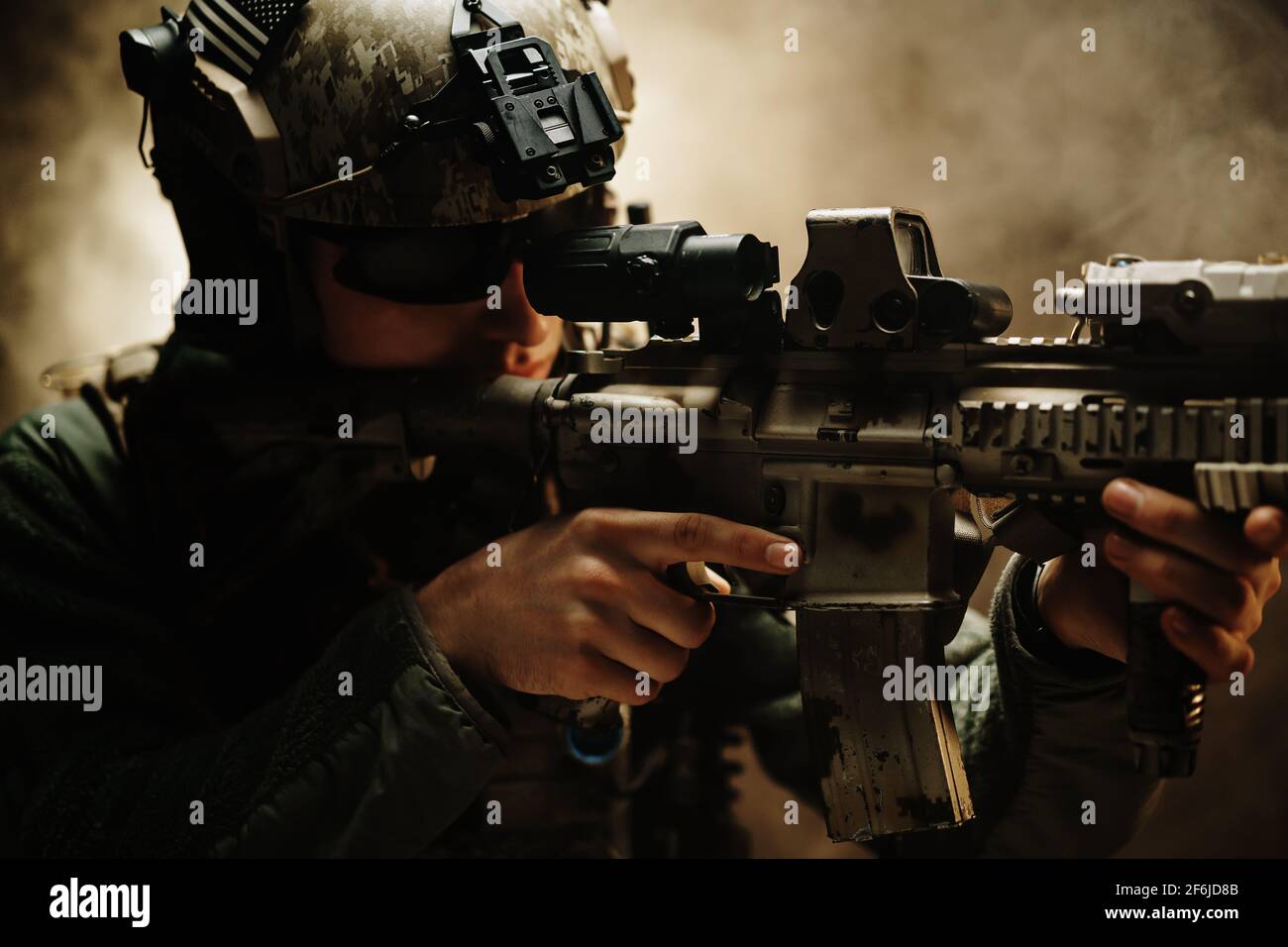 Special forces soldier aiming with his rifle in fog Stock Photo - Alamy