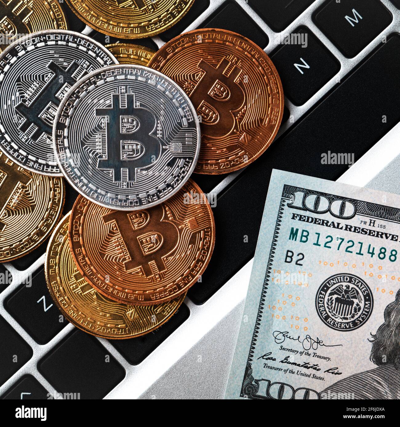 Business top view design concept of cryptocurrency bitcoin with USD Dollar  paper currency money on laptop over dark black table background Stock Photo  - Alamy