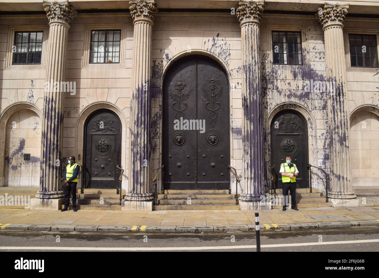London, United Kingdom. 1st April 2021. Extinction Rebellion activists covered the Bank Of England in fake oil as part of nationwide 'Money Rebellion' protests targeting banks over, the activists say, their role in the climate and ecological crisis. Stock Photo