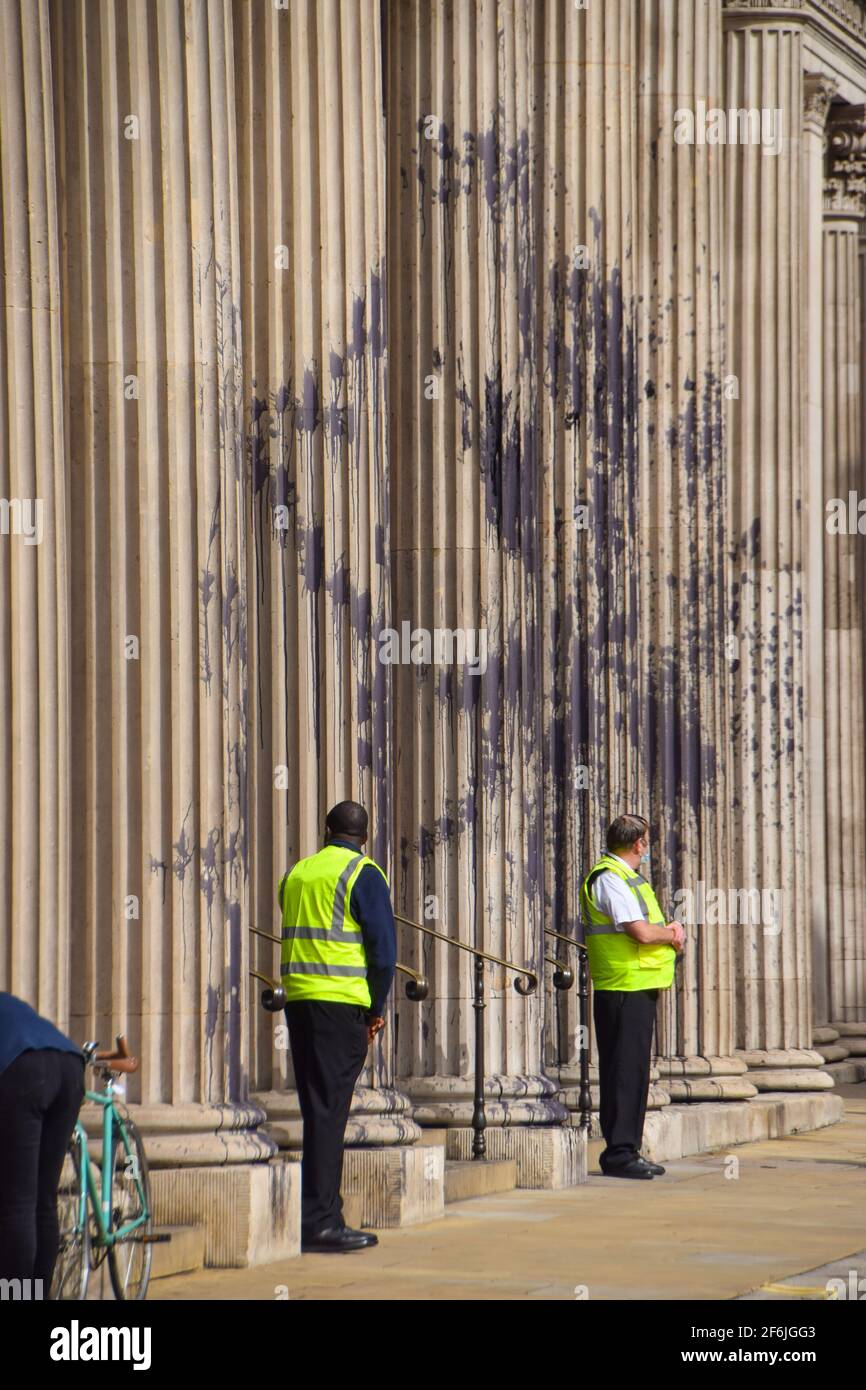 London, United Kingdom. 1st April 2021. Extinction Rebellion activists covered the Bank Of England in fake oil as part of nationwide 'Money Rebellion' protests targeting banks over, the activists say, their role in the climate and ecological crisis. Stock Photo