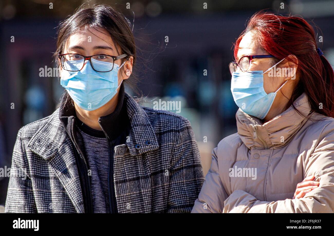 Wearing two face masks hi-res stock photography and images - Alamy