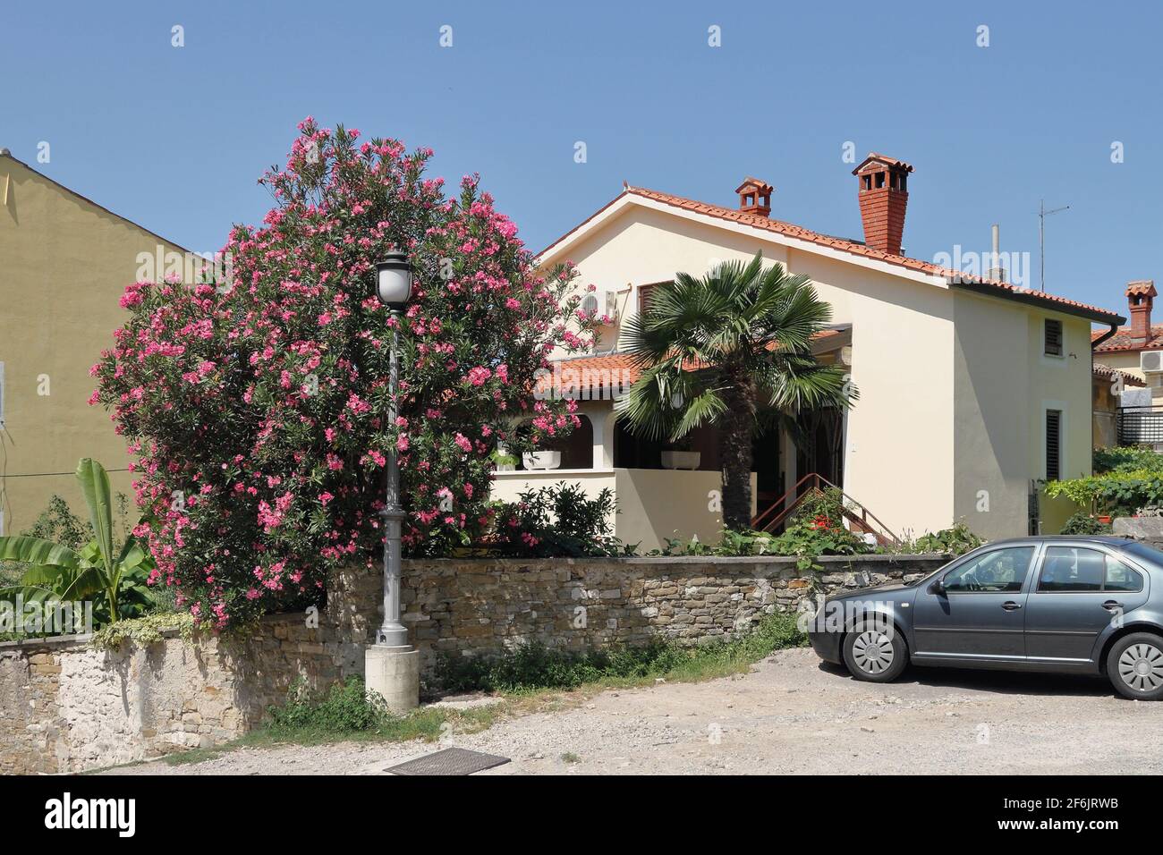 Apartment building and car at entrance. Isola, Slovenia Stock Photo