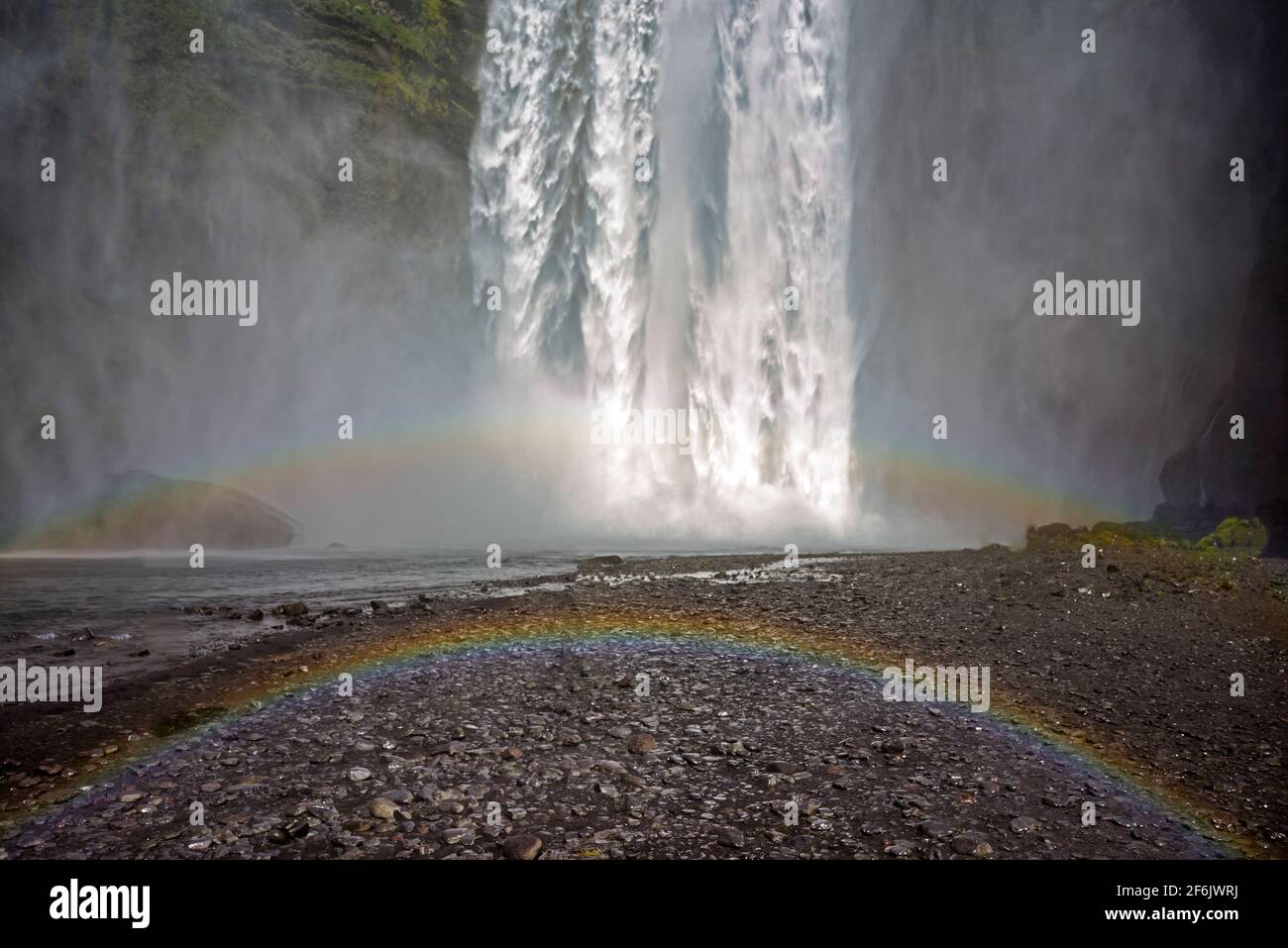 Double rainbow at Skógafoss, a waterfall on the Skógá River in the south of Iceland at the cliff marking the former coastline Stock Photo