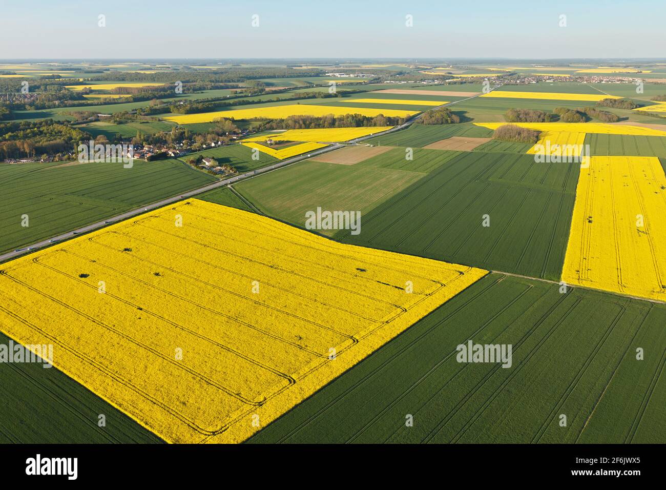Aerial photograph of rapeseed fields in Prunay-en-Yvelines, in the south of the Yvelines department, in Île-de-France région, France. Municipality of - Stock Image
