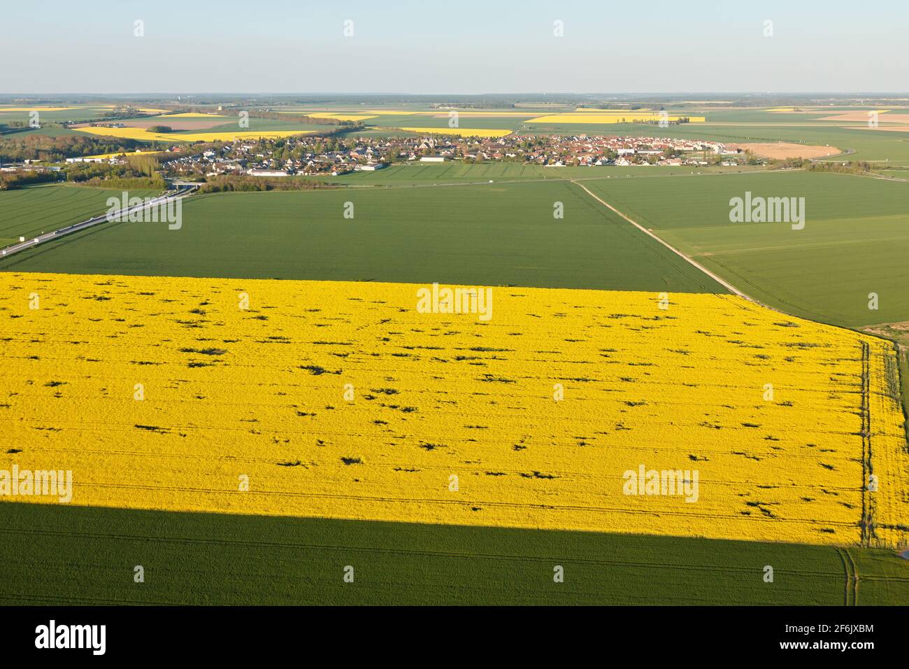 Aerial photograph of a rapeseed field in Ablis, in the south of the Yvelines department, in the Île-de-France region, France. Municipality of the natu - Stock Image