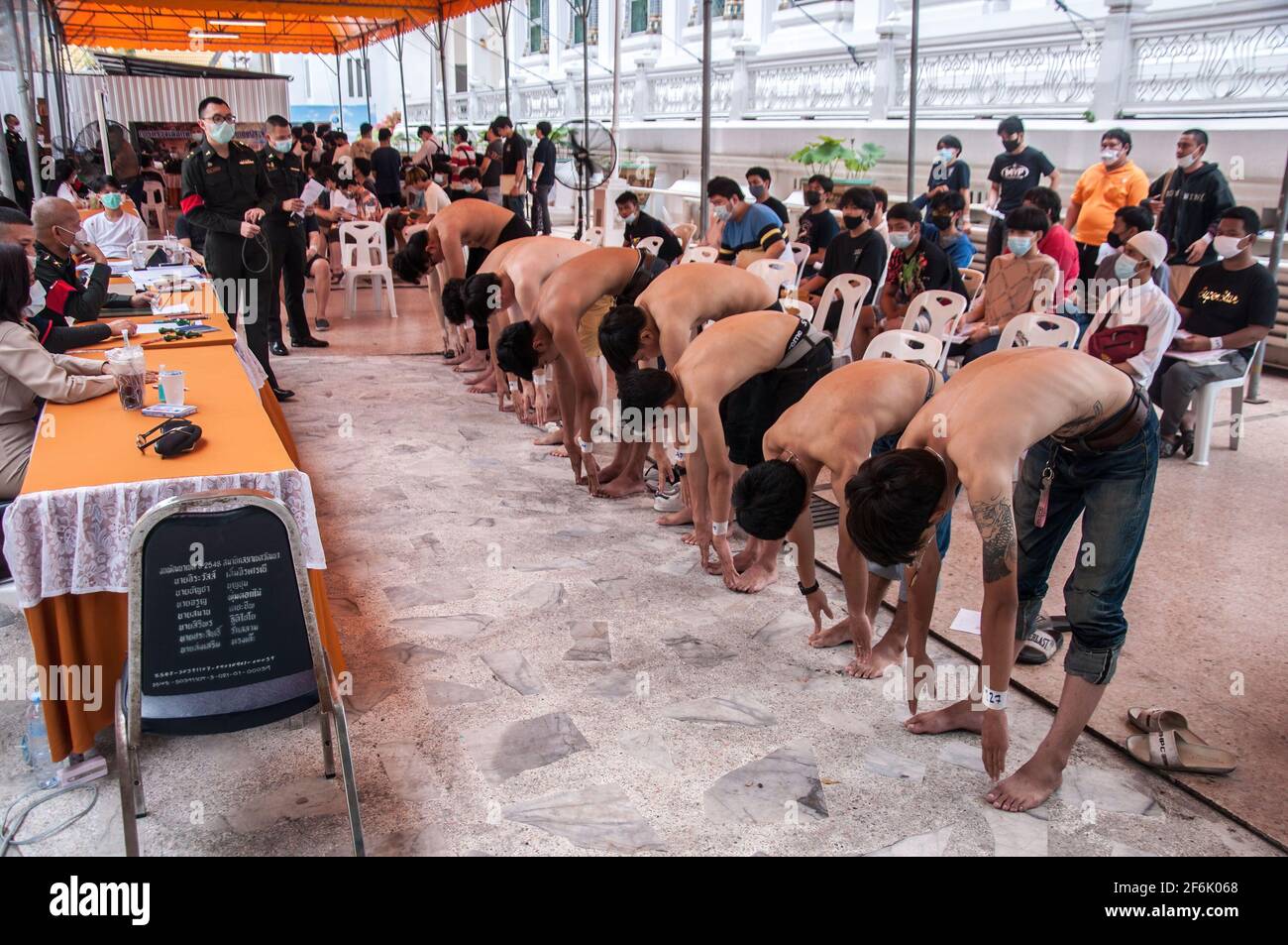 Thai men making physical examinations during military conscription at Wat That Thong. The Royal Thai Armed Forces launched their annual military conscription draft day by starting from 1 April 2021 to 20 April 2021 searching for healthy men of fighting age from 21 years old and above from the whole country by Voluntary and Drawing a lottery. Stock Photo