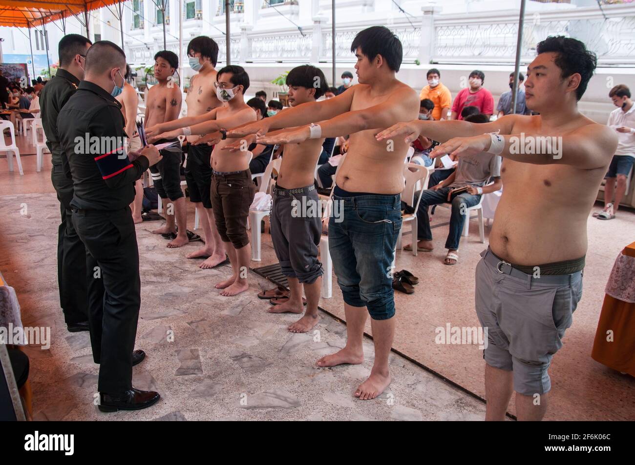 Thai men making physical examinations during military conscription at Wat That Thong. The Royal Thai Armed Forces launched their annual military conscription draft day by starting from 1 April 2021 to 20 April 2021 searching for healthy men of fighting age from 21 years old and above from the whole country by Voluntary and Drawing a lottery. Stock Photo