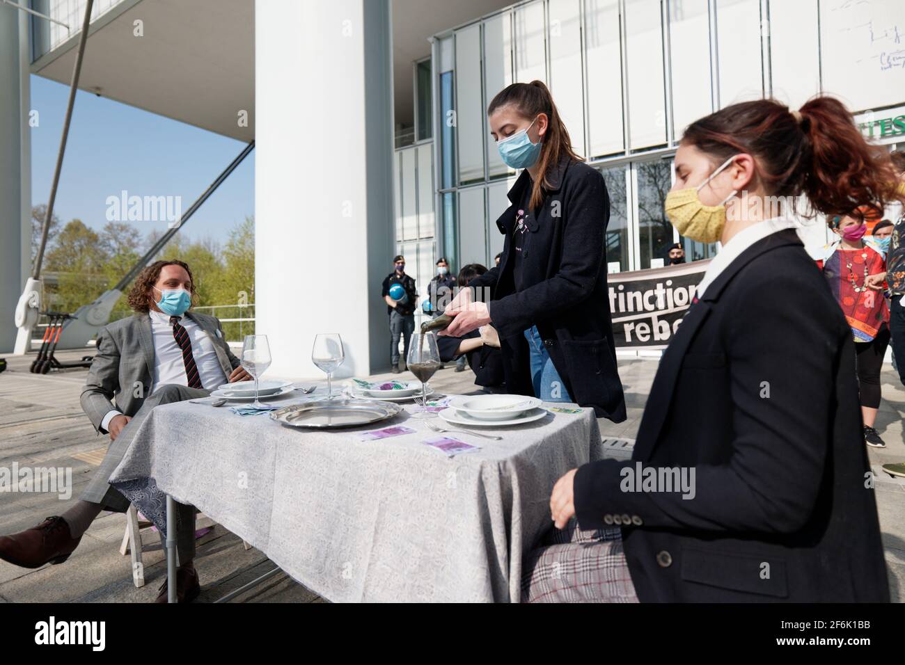 Turin, Italy. 1st Apr, 2021. Extinction Rebellion activists take nonviolent civil disobedience against the finance industry and banks that fund the fossil fuel. Credit: MLBARIONA/Alamy Live News Stock Photo
