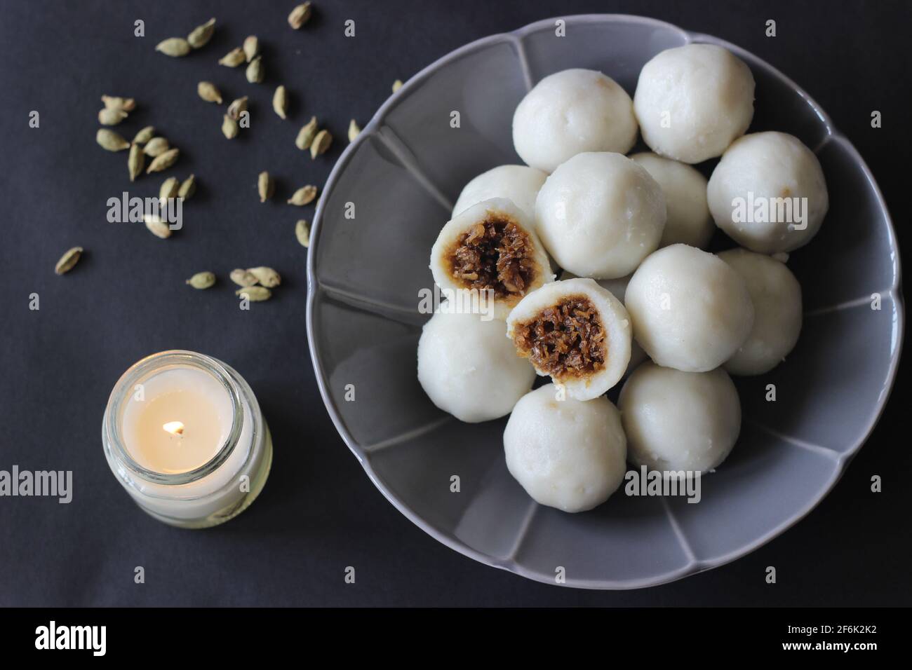 Steamed dumplings made with rice flour dough and stuffed with a filling of coconut and jaggery prepared by Kerala Christians on easter Saturday Stock Photo