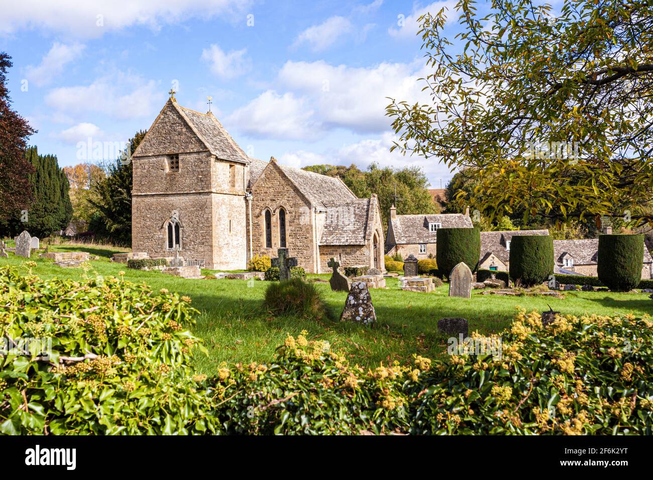 Autumn at St Peters church in the Cotswold village of Duntisbourne Abbots, Gloucestershire UK Stock Photo