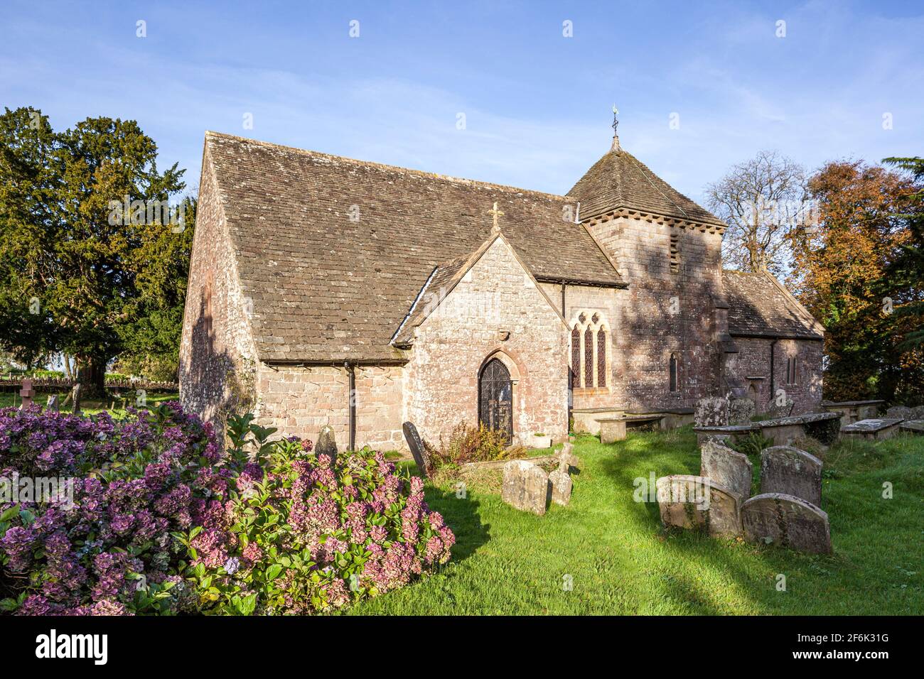 St Mary Magdalene church, set in a circular churchyard, at Hewelsfield in the Forest of Dean, Gloucestershire UK Stock Photo