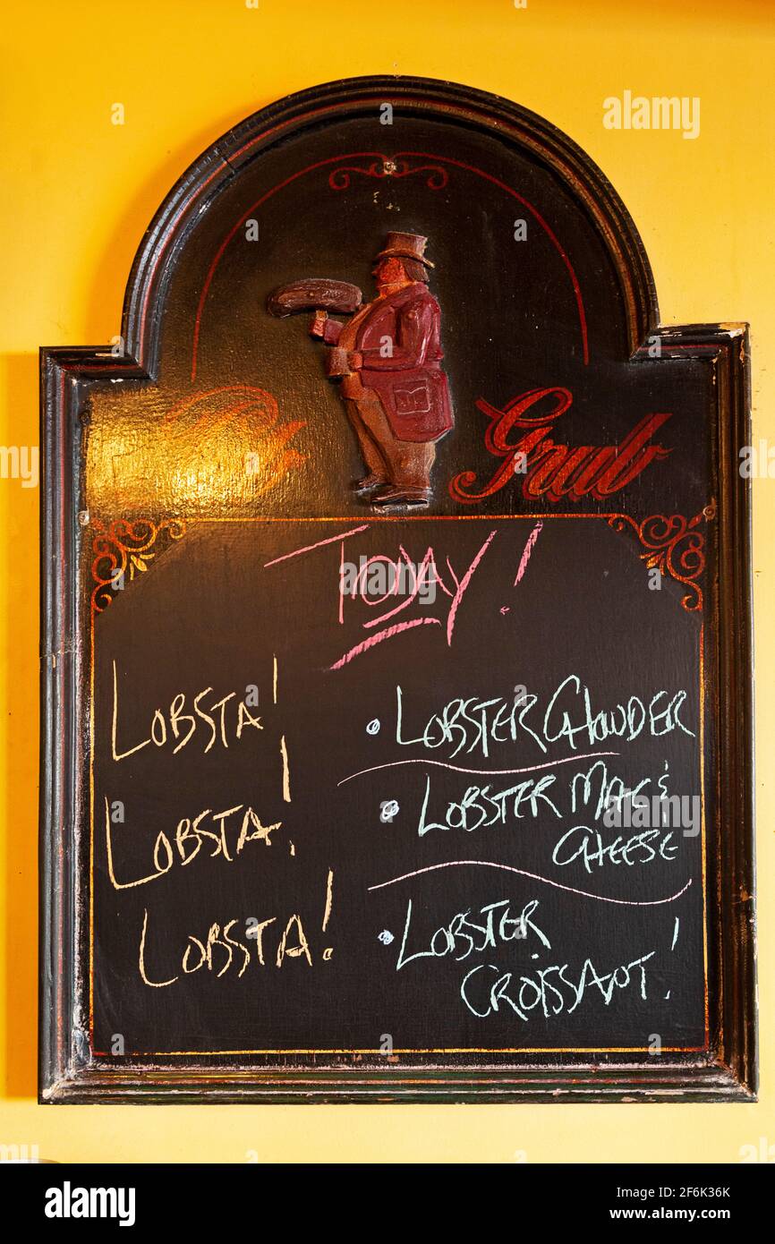 Chalkboard sign advertising lobster at Chester in Nova Scotia, Canada. The dish is a regional delicacy. Stock Photo