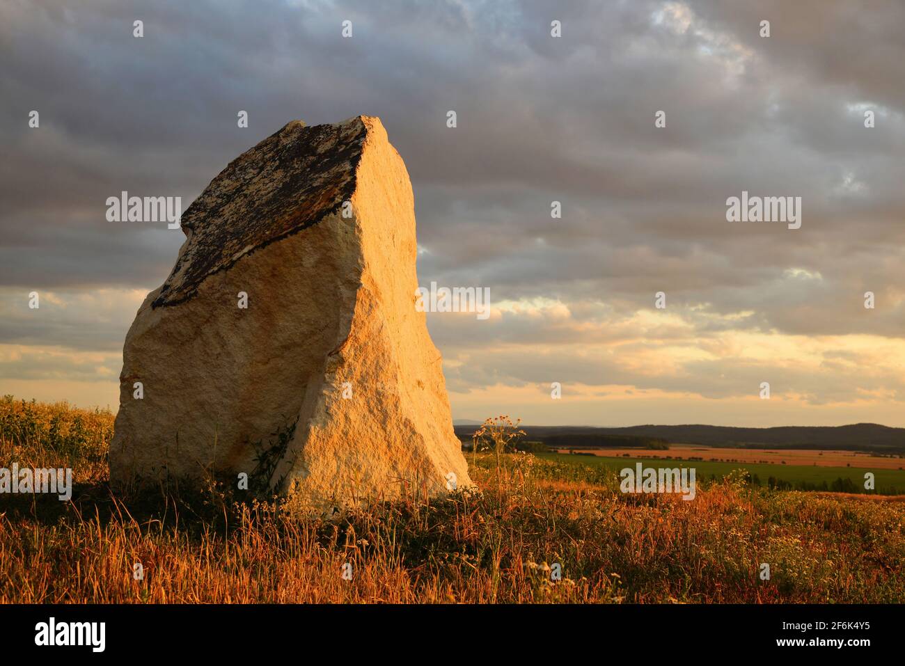 Ancient standing stone with dramatic sky hi-res stock photography and ...