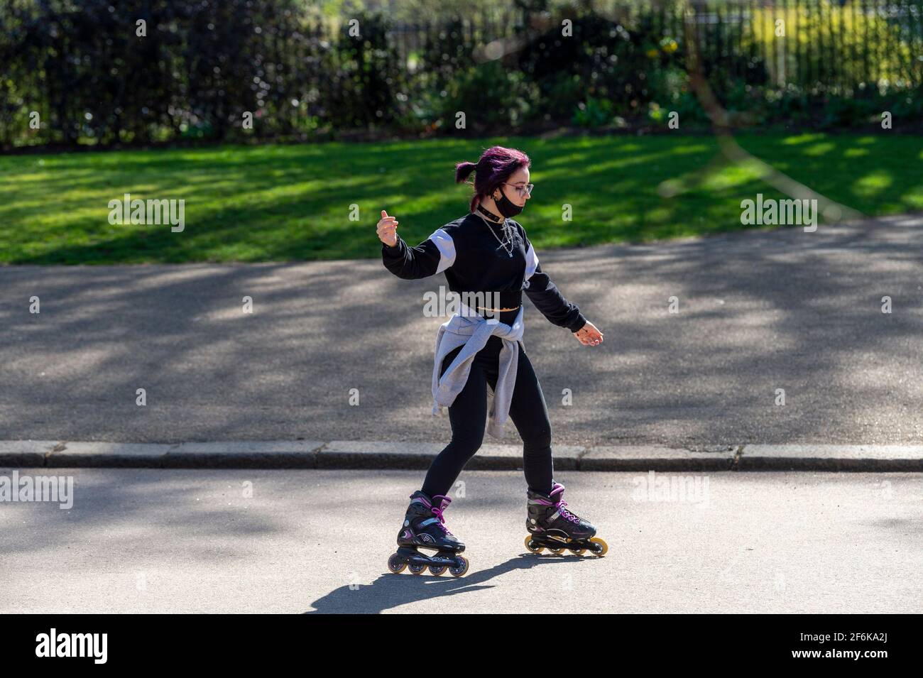 A woman on skates seen in London’s Hyde Park. Stock Photo