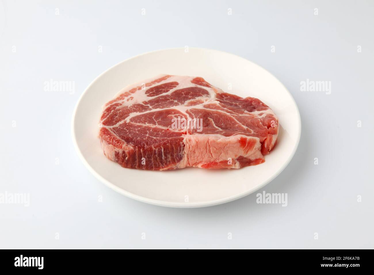 raw pork meat isolated on white background Stock Photo - Alamy