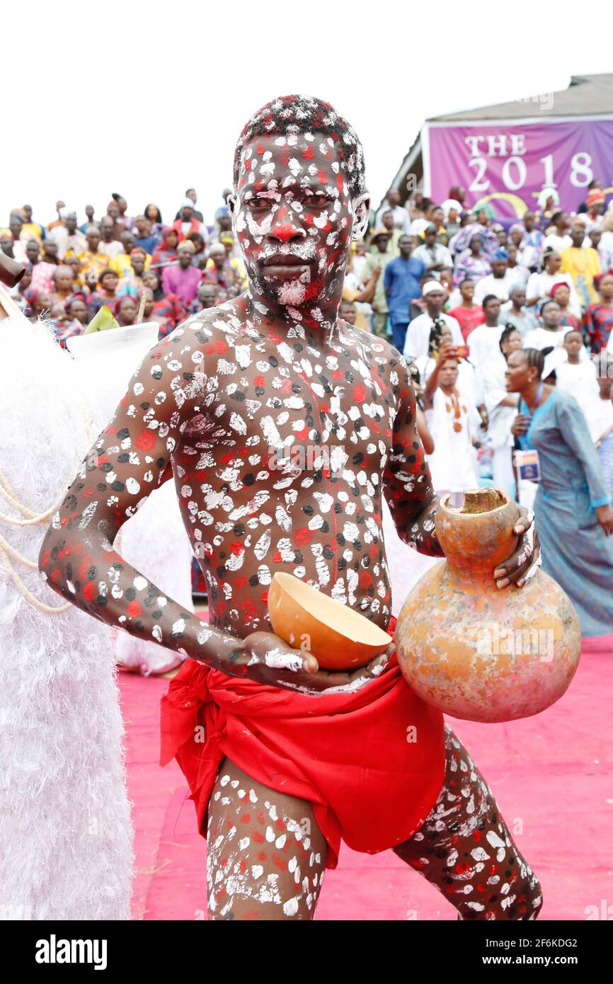 Sopona devotee with his palm wine performing during Olojo Festival, Ile-Ife, Osun State, Nigeria. Stock Photo