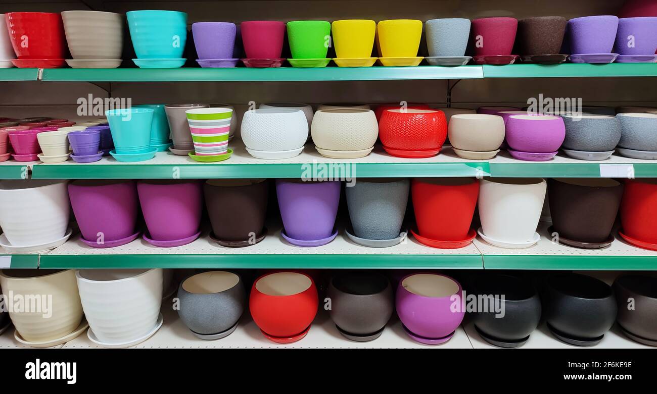 Many colorful ceramic and plastic flower pots at store Stock Photo Alamy